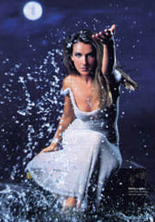 Celine Dion splashing water in a kneeling pose, on the cover of Cosmopolitan