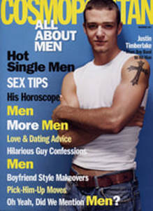 Justin Timberlake standing with his arms crossed on the magazine cover of Cosmopolitan